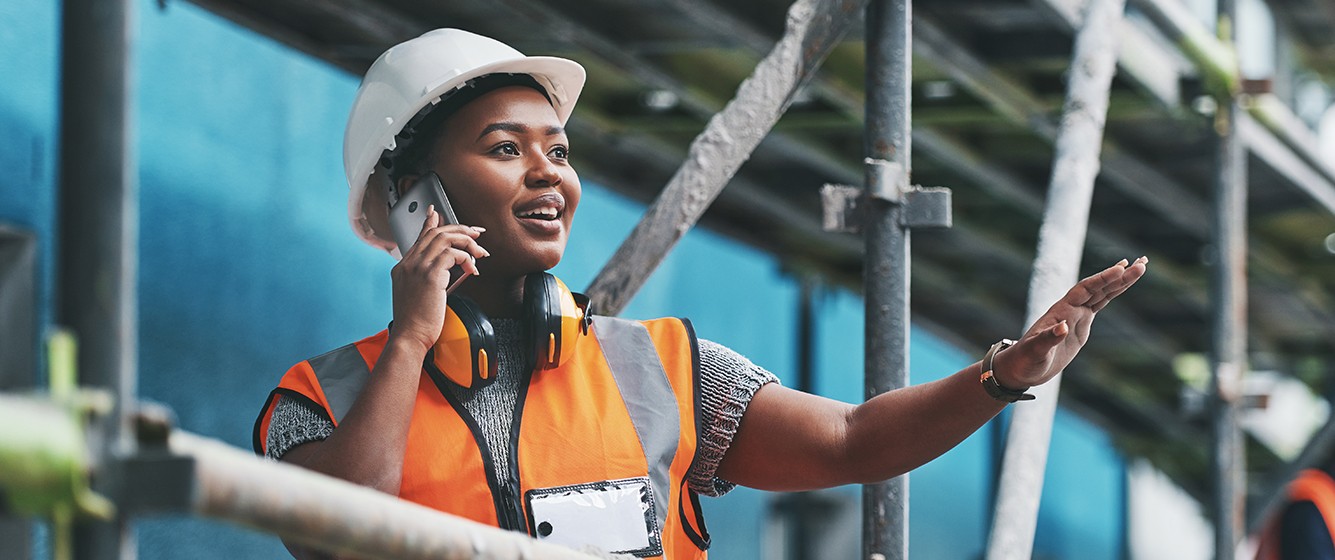 female construction worker on phone